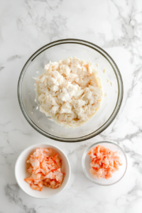 This image shows delicate lump crab meat being carefully folded into the creamy dip mixture, ensuring even distribution while maintaining the tender texture of the seafood.
