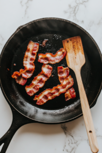 frying-crispy-bacon-in-a-skillet-for-colcannon