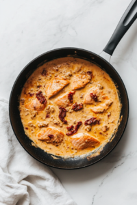 garnishing-the-salmon-with-fresh-basil-and-lemon-zest-for-a-bright-finish