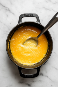 heating-ghee-in-kadai-for-cooking-sooji-halwa