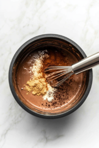 infusing-the-hot-chocolate-with-aromatic-spices-while-simmering