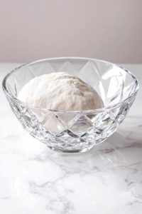 This image shows the dough being kneaded for an additional two minutes on speed 2, ensuring it becomes smooth and elastic.