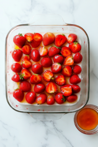 layering-freshly-sliced-strawberries-evenly-over-cream-cheese-filling