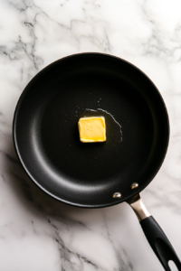 melting-butter-in-a-large-pan-to-start-the-jambalaya-base