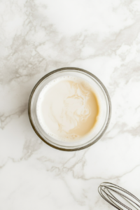 mixing-custard-powder-with-warm-milk-in-a-bowl