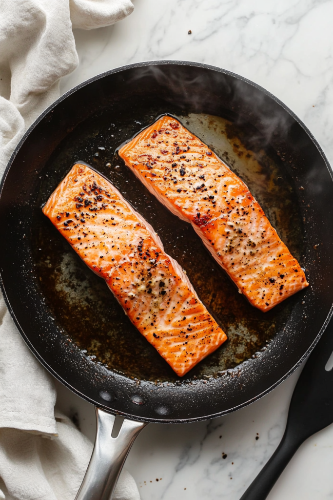 perfectly-pan-seared-salmon-with-a-golden-crisp-exterior-in-a-skillet-9355944-683x1024