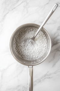 preparing-sugar-syrup-for-sooji-halwa-recipe