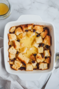 preparing-the-baking-dish-for-bread-pudding-with-a-light-grease-coating