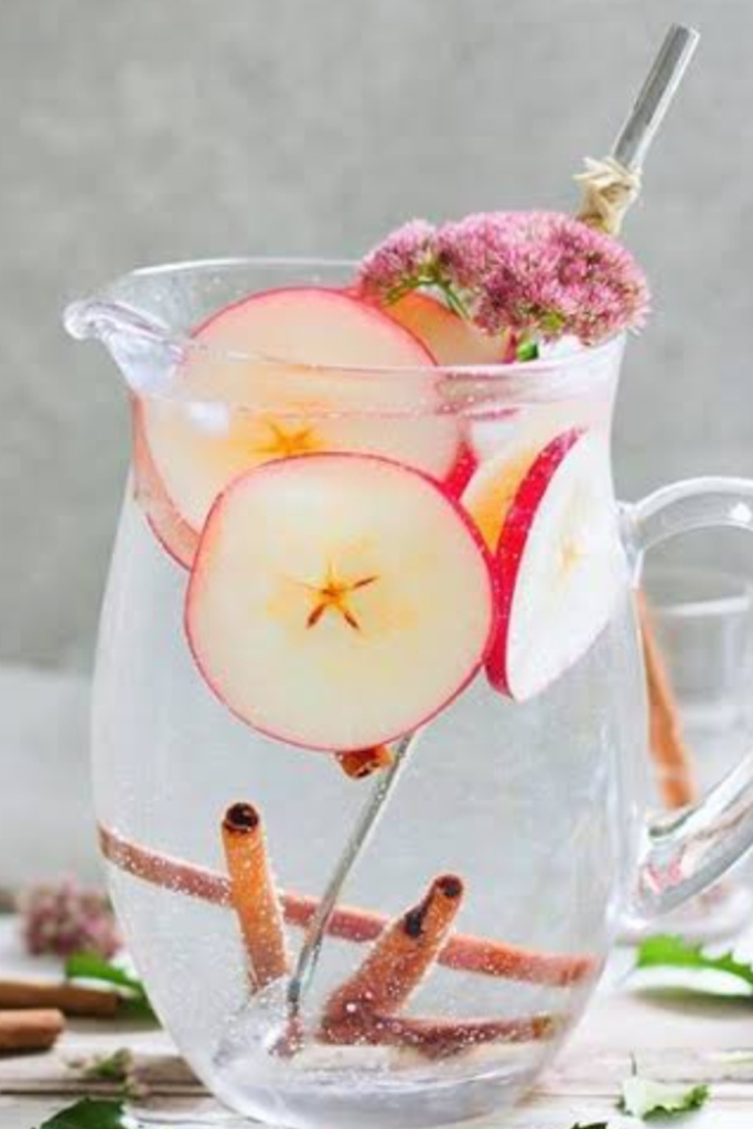 refreshing-apple-and-cinnamon-infused-water-in-a-glass-jar-with-spices