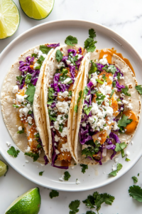 serving-the-fish-tacos-with-a-garnish-of-cilantro-and-a-squeeze-of-lime