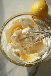 This image shows an oven preheating to the ideal temperature while baking sheets are lined with parchment paper, ready for the cheese Danish pastries.
