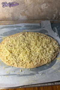 Sprinkle mozzarella, parmesan, garlic salt