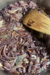 Stir in red onion and cook