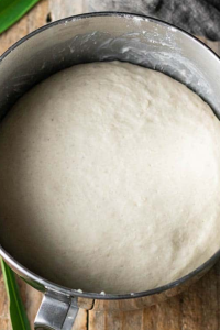 Transfer to a greased bowl