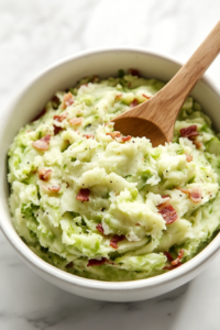 transferring-the-finished-colcannon-into-a-serving-bowl
