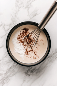 warming-milk-and-dissolving-cocoa-for-a-smooth-base