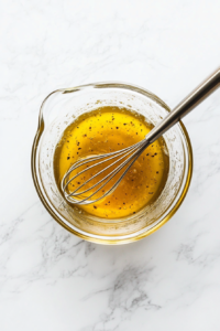 This image shows the cucumber and tomato salad being seasoned with salt and black pepper, adding essential flavor to the fresh ingredients.
