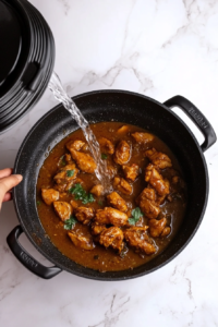 adding-water-and-covering-the-karahi-for-slow-cooking