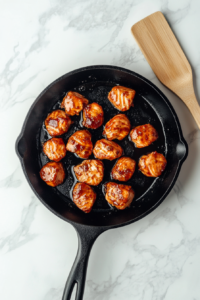 This image shows the honey garlic salmon bites resting for a few moments, letting the flavors settle before serving.