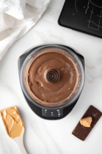 blending-ingredients-for-creamy-chocolate-peanut-butter-smoothie-top-down-view