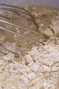 combine warm water, flour, and yeast