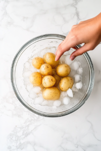 cooling-boiled-potatoes-in-an-ice-bath-to-stop-cooking