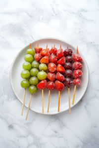 This image shows freshly coated Tanghulu skewers resting on a cooling rack. As the sugar hardens, it forms a crisp, glass-like shell that cracks delightfully with each bite.