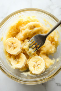 mashing-ripe-bananas-to-create-a-sweet-and-creamy-banana-bread-base