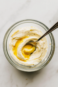 mixing-creamy-dressing-with-mayonnaise-mustard-and-seasonings