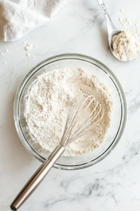 mixing-flour-baking-powder-and-salt-in-a-medium-bowl