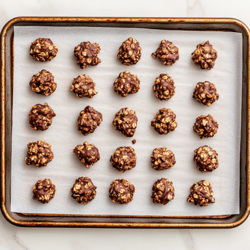 oatmeal-banana-chocolate-chip-muffins-in-baking-tray-with-chocolate-oats-and-nuts