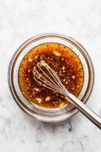 whisking-a-sweet-and-savory-honey-garlic-sauce-for-the-salmon-bites
