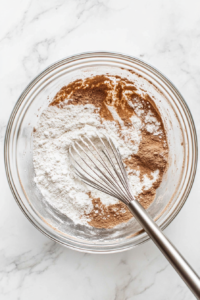 whisking-flour-baking-soda-and-spices-for-even-banana-bread-texture