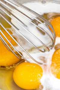 Add eggs, ½ cup of rum