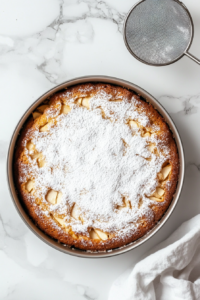 Cake pan placed on an oven rack, beginning to bake.