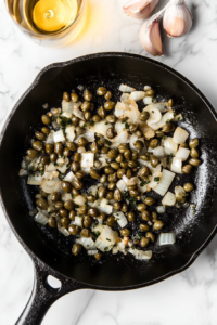 adding-capers-and-white-wine-to-sauce-base