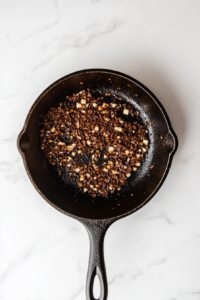 adding-garlic-to-sauteed-shallots-in-olive-oil