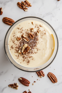 adding-pudding-mix-cinnamon-salt-and-pecans-into-the-cream-cheese-blend