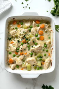 chicken-mixture-poured-into-greased-white-baking-dish