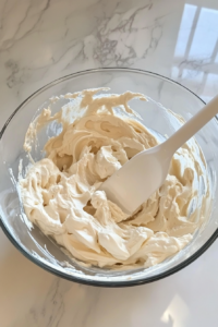 cloudlike-meringue-being-folded-gently-into-the-creamy-cheesecake-base