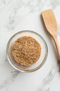 cooling-the-toasted-sesame-seeds-on-a-plate-to-prevent-over-roasting-top-down-shot