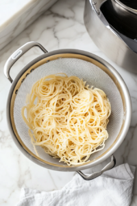 draining-cooked-pasta-and-prepping-for-mixing