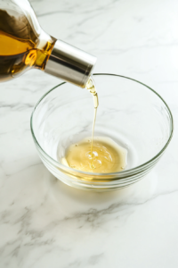 emulsifying-the-dressing-by-whisking-oil-vinegar-and-seasonings-for-a-smooth-blend-top-down-shot