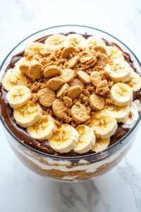 final-layer-of-trifle-topped-with-extra-chocolate-shavings-and-banana-slices-for-garnish