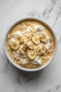 folding-whipped-topping-into-the-pudding-to-create-a-light-fluffy-filling