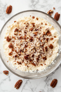 forming-a-deep-well-in-the-cheese-mixture-to-hold-caramel-center