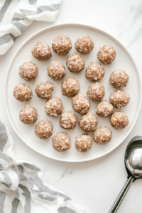 forming-the-sausage-mixture-into-evenly-sized-balls-for-consistent-baking-2