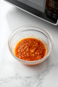 heating-sweet-chili-sauce-in-pan-until-bubbly-and-fragrant
