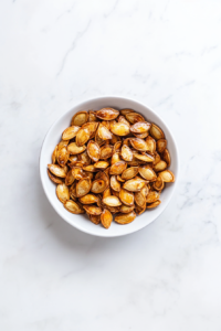 honey-roasted-pumpkin-seeds-served-in-white-dish-with-sugar-sprinkle-2