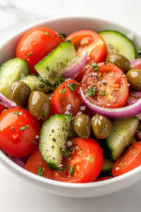 This image shows a vibrant addition of kalamata olives, capers, oregano, salt, and a hint of white pepper layered over the vegetables.